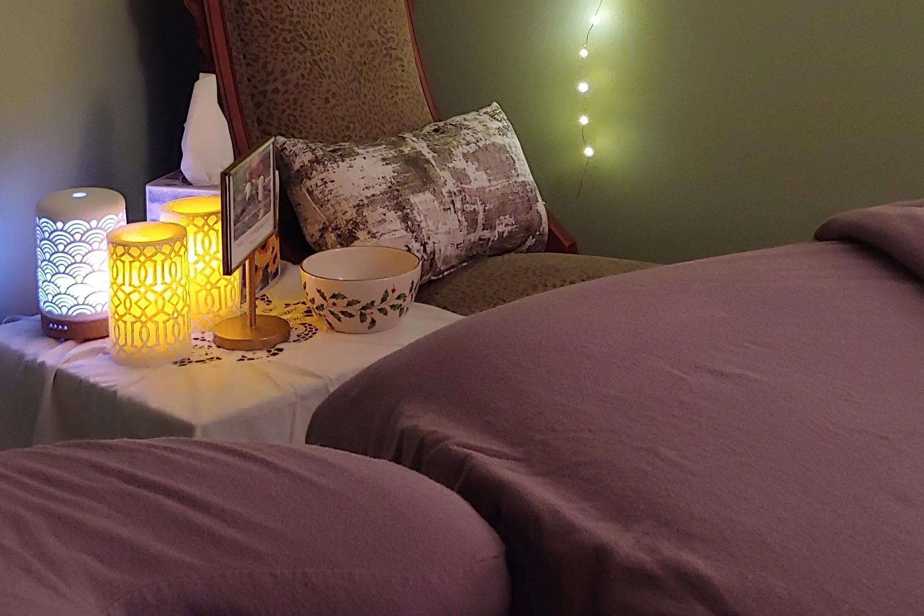 The treatment room at Conscious Touch, a massage table under soft light